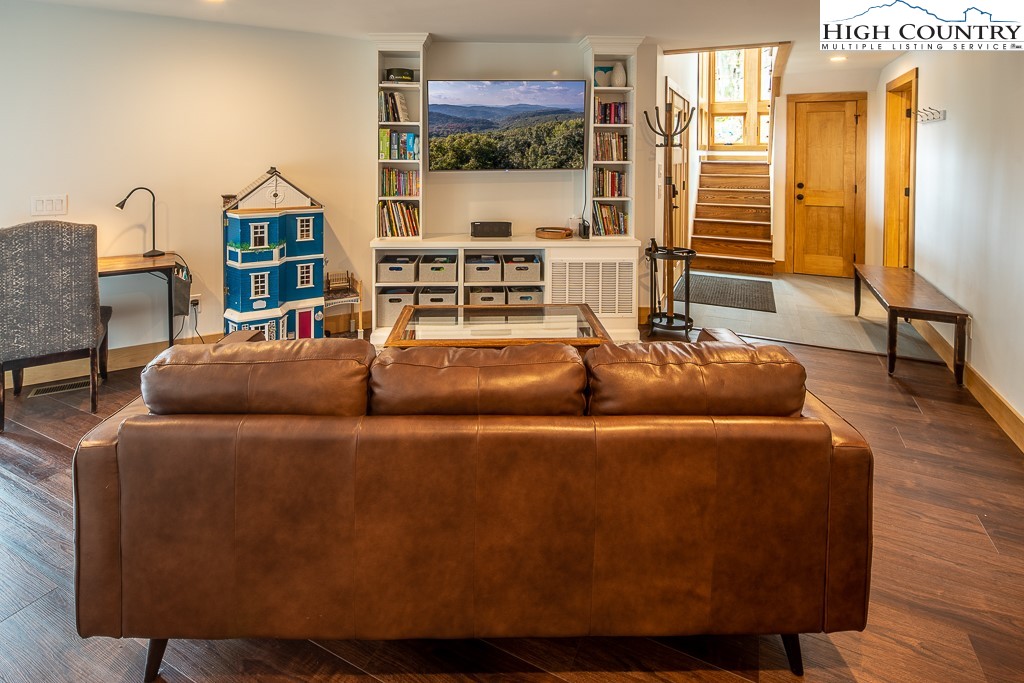 102 Ski Beech Road Beech Mountain, NC 28604 - Photo 24 of 40 a living room with furniture and a floor to ceiling window