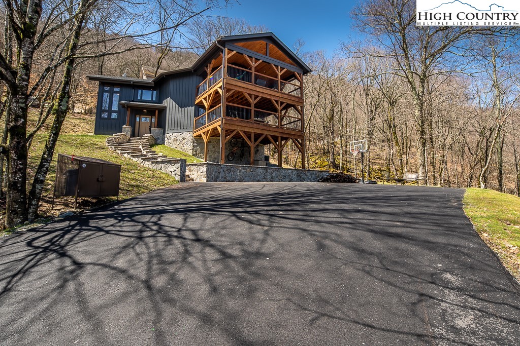 102 Ski Beech Road Beech Mountain, NC 28604 - Photo 35 of 40 a front view of a house with a yard