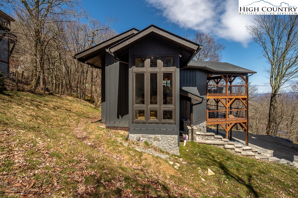 102 Ski Beech Road Beech Mountain, NC 28604 - Photo 5 of 40 a view of a house with wooden fence