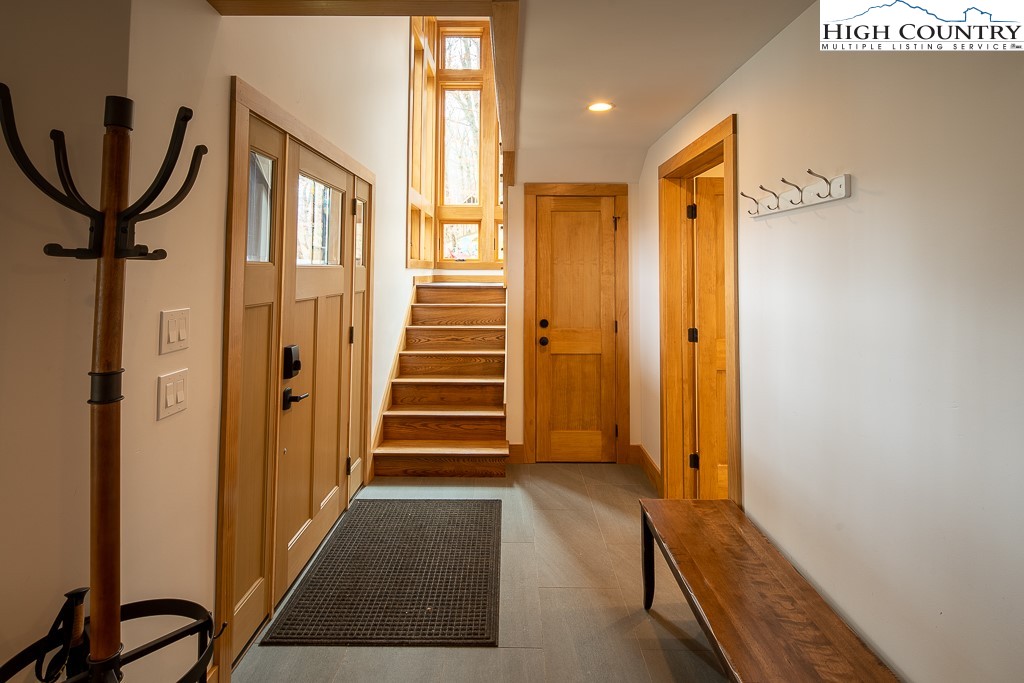 102 Ski Beech Road Beech Mountain, NC 28604 - Photo 8 of 40 a view of a hallway with wooden floor and entryway