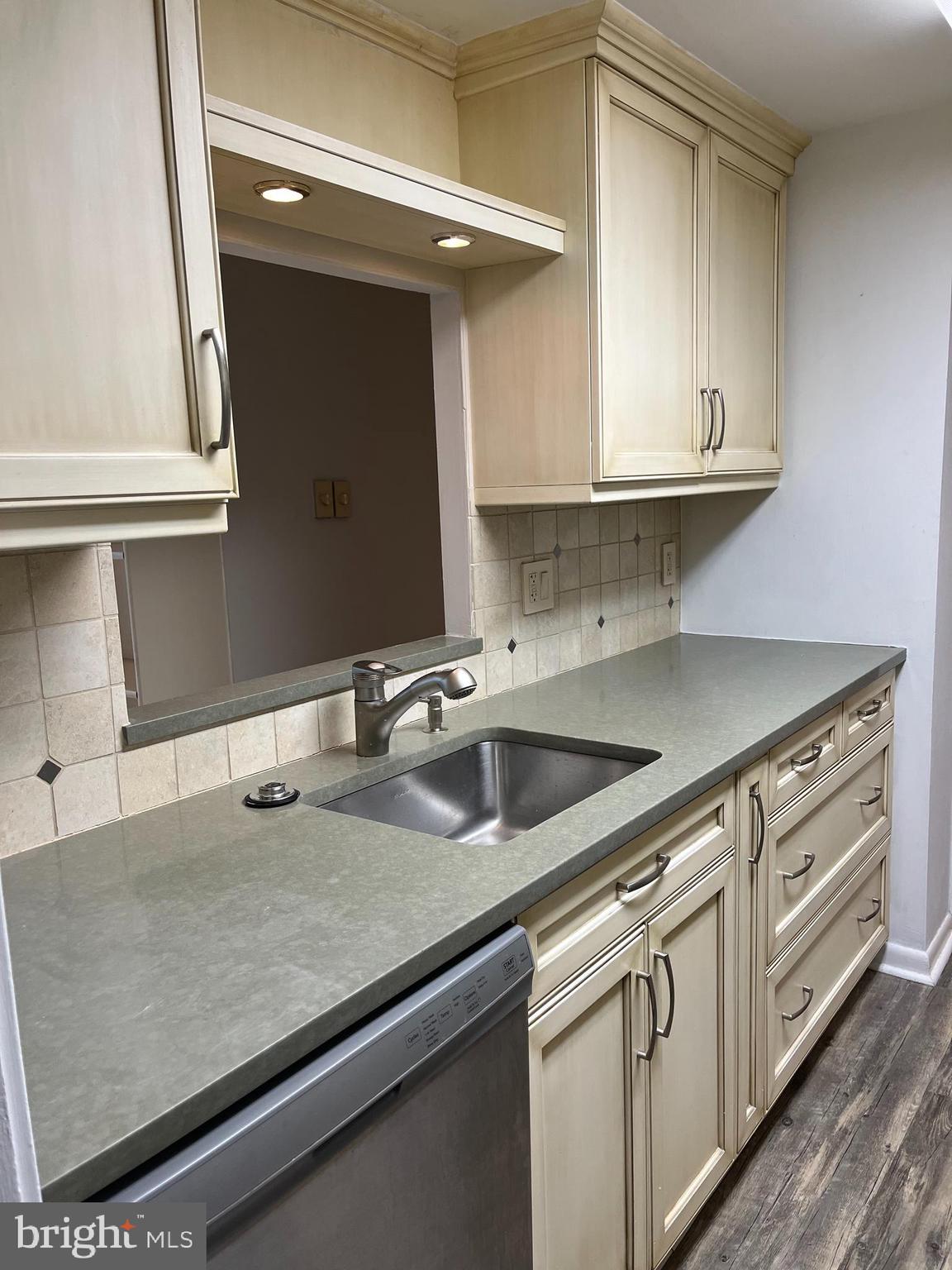 100 West Avenue, Unit 118S Jenkintown, PA 19046 - Photo 13 of 36 a kitchen with stainless steel appliances granite countertop a sink and a stove