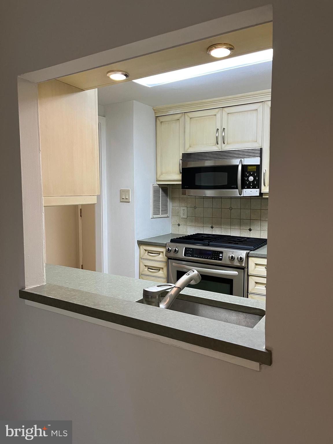 100 West Avenue, Unit 118S Jenkintown, PA 19046 - Photo 14 of 36 a kitchen with a stove and a microwave