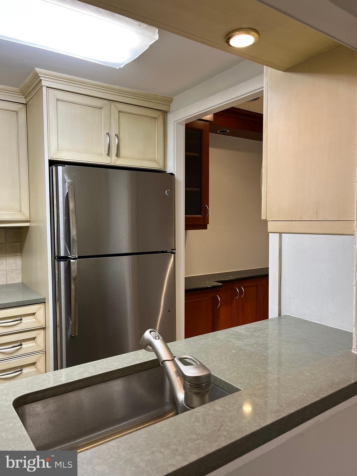 100 West Avenue, Unit 118S Jenkintown, PA 19046 - Photo 15 of 36 a kitchen with a refrigerator and a sink
