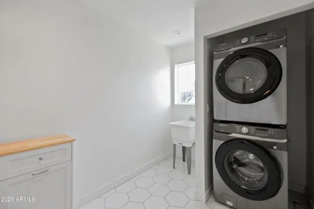 a utility room with dryer and washer