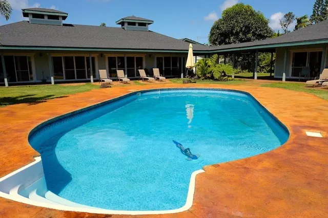 a view of a house with swimming pool