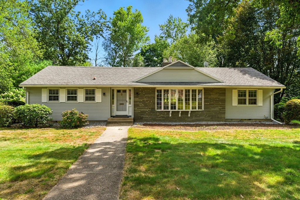 925 Williams Street Longmeadow, MA 01106 - Photo 1 of 38 a front view of a house with a garden
