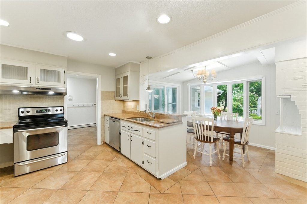 925 Williams Street Longmeadow, MA 01106 - Photo 12 of 38 a kitchen with cabinets and chairs