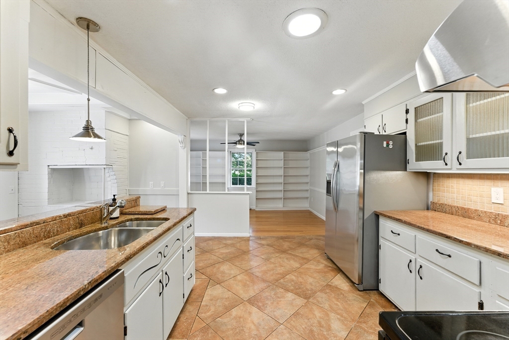 925 Williams Street Longmeadow, MA 01106 - Photo 13 of 38 a kitchen with granite countertop a sink and cabinets
