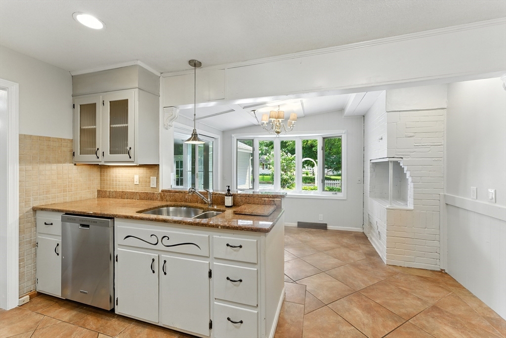 925 Williams Street Longmeadow, MA 01106 - Photo 15 of 38 a kitchen with granite countertop a sink and cabinets
