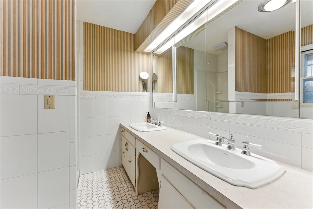 925 Williams Street Longmeadow, MA 01106 - Photo 22 of 38 a bathroom with a sink and a mirror
