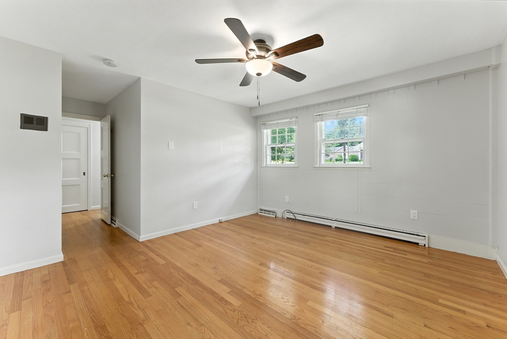 925 Williams Street Longmeadow, MA 01106 - Photo 26 of 38 wooden floor in an empty room with a window
