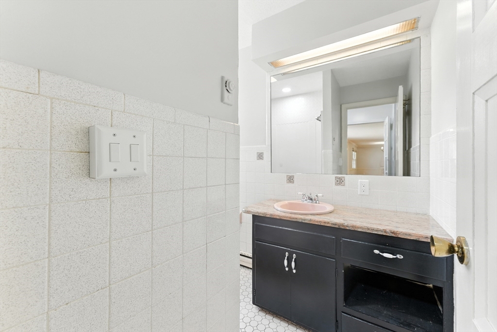 925 Williams Street Longmeadow, MA 01106 - Photo 27 of 38 a bathroom with a sink vanity and a mirror