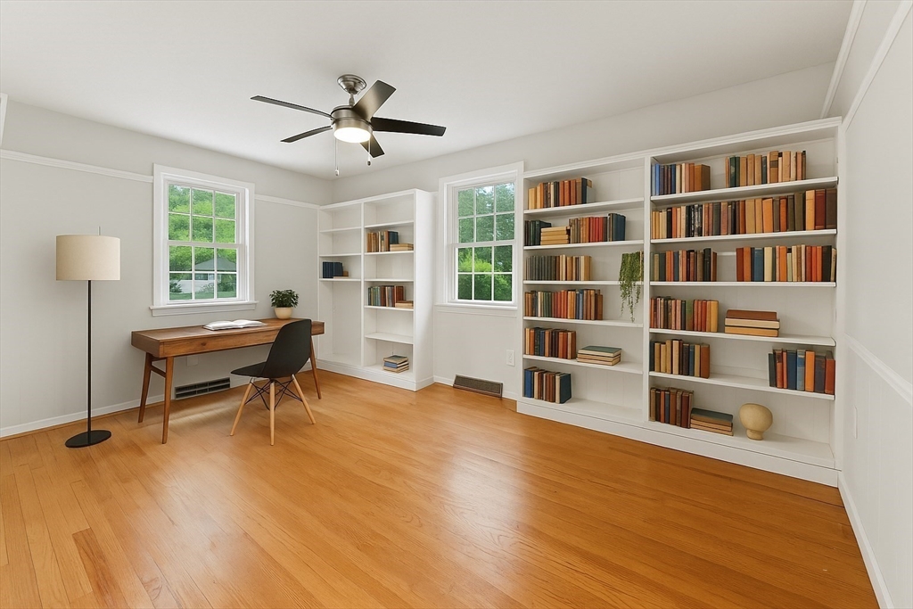 925 Williams Street Longmeadow, MA 01106 - Photo 9 of 38 a living room with furniture and a book shelf