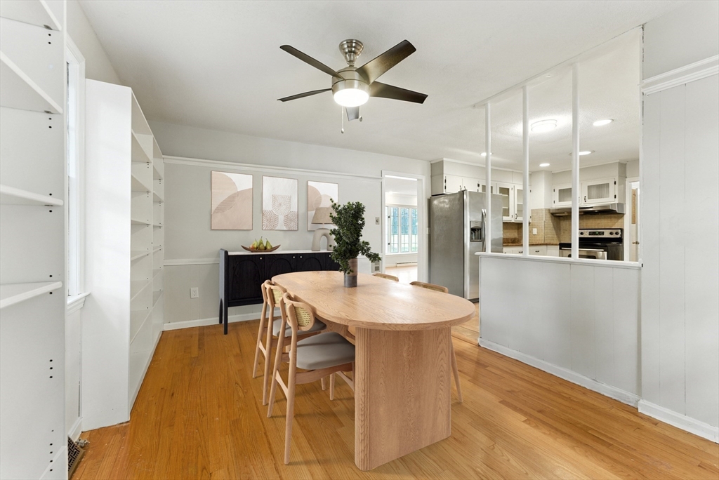 925 Williams Street Longmeadow, MA 01106 - Photo 10 of 38 a kitchen with stainless steel appliances kitchen island granite countertop a refrigerator a sink a stove and white cabinets with wooden floor
