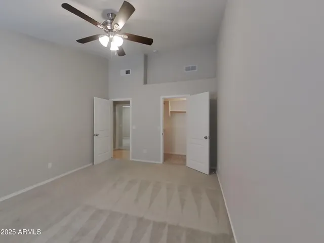 a kitchen with a refrigerator a sink and cabinets