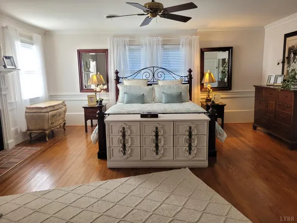 a bedroom with a bed and a fireplace