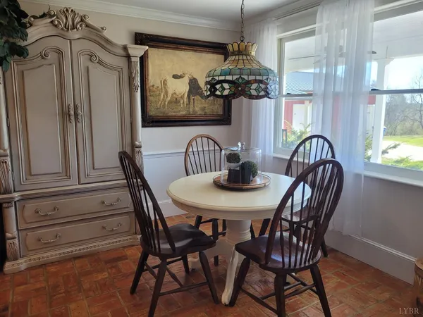 a view of a dining room with furniture window and outside view