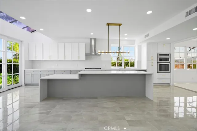 a bathroom with a granite countertop sink a toilet and a shower