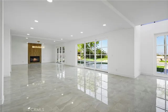 a view of a swimming pool with palm trees