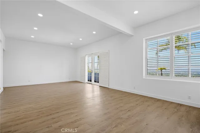 a front view of a house with a yard and a fountain