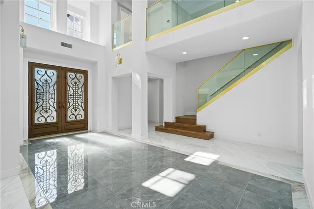 a kitchen with kitchen island granite countertop a stove a sink and a counter top space