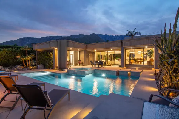 a view of a swimming pool with a patio