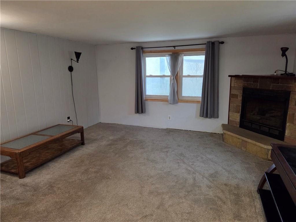 1930 Branchton Road Hilliards, PA 16040 - Photo 14 of 27 a view of an empty room with a fireplace and a window