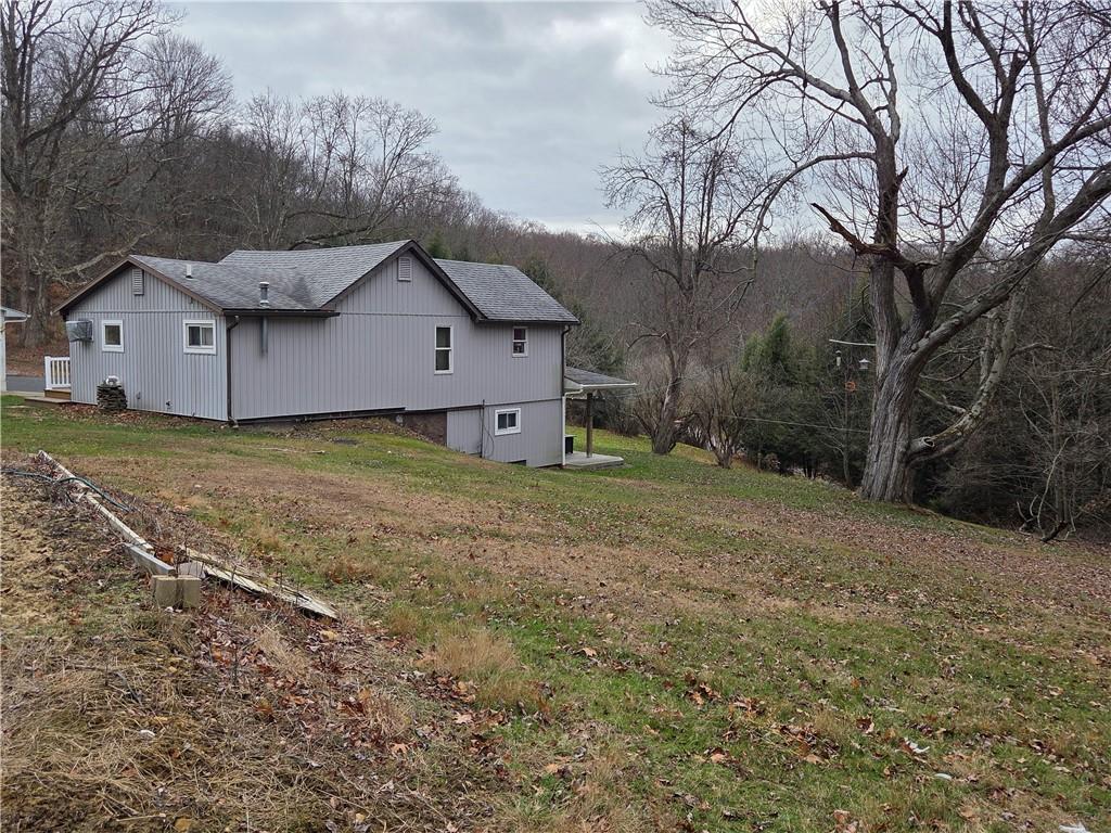 1930 Branchton Road Hilliards, PA 16040 - Photo 7 of 27 a house that is sitting in the middle of a field