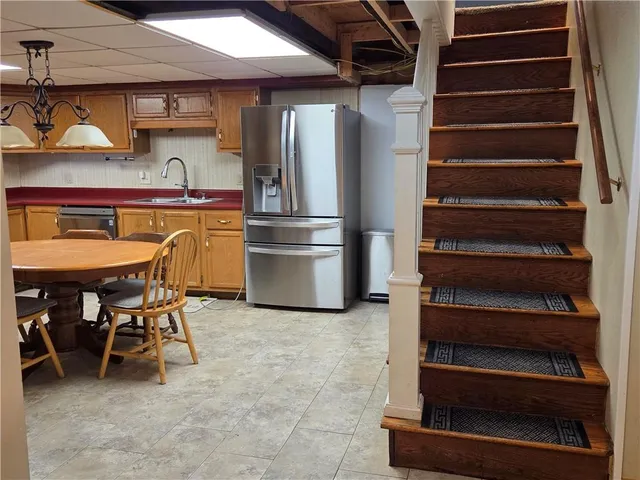 a view of dinning room with chairs and entryway