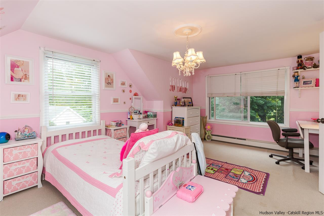 6 Van Road Fishkill, NY 12524 - Photo 17 of 23 a bed room with a bed and a chandelier