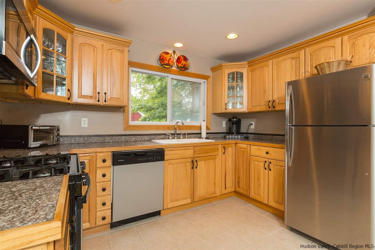 6 Van Road Fishkill, NY 12524 - Photo 8 of 23 a kitchen with stainless steel appliances granite countertop a refrigerator a stove a sink and a microwave