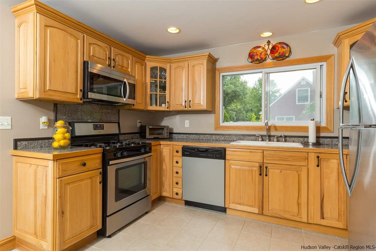 6 Van Road Fishkill, NY 12524 - Photo 9 of 23 a kitchen with stainless steel appliances granite countertop a stove a sink and a microwave
