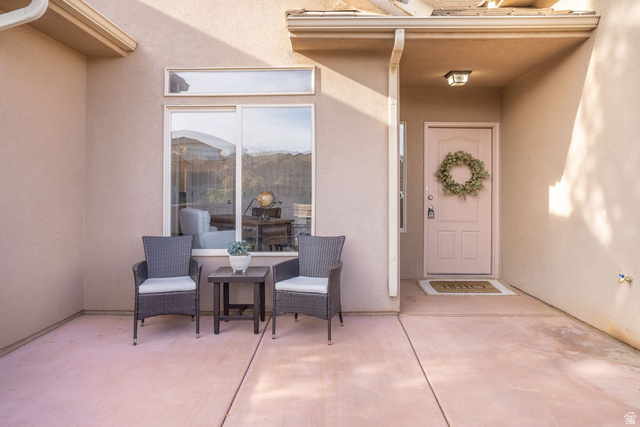 1570 South Rio Virgin Drive Washington, UT 84780 - Photo 6 of 71 View of exterior entry featuring stucco siding and a patio area