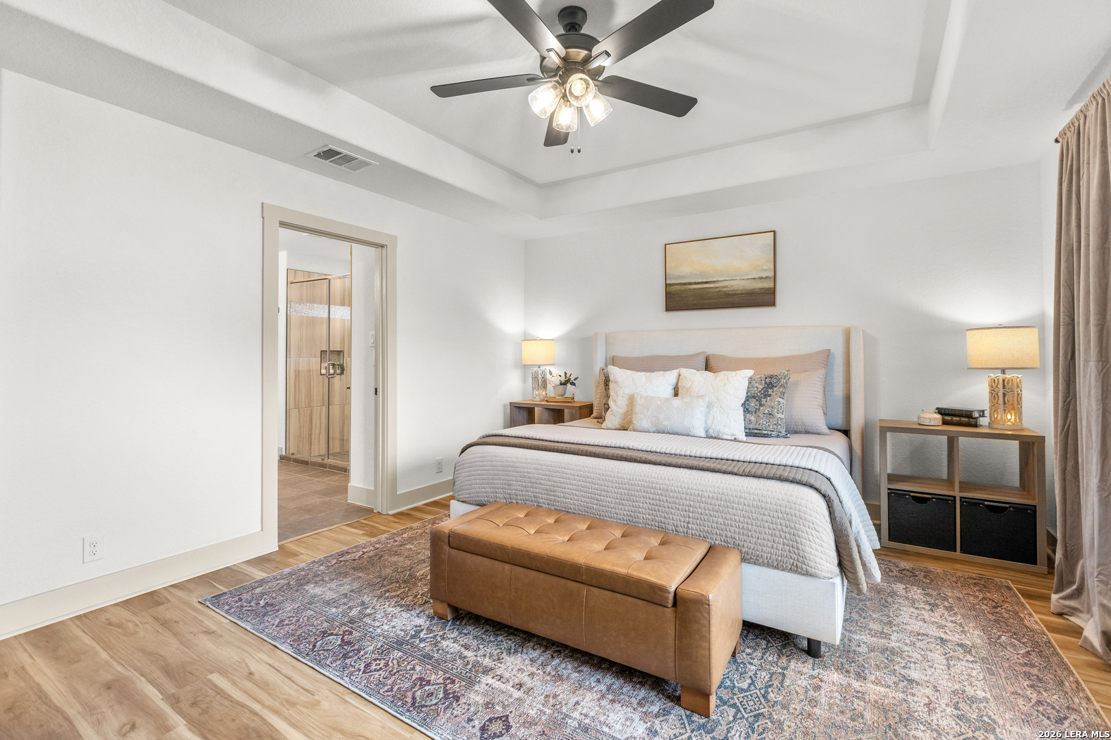 116 Hiram Cook Blanco, TX 78606 - Photo 20 of 53 a spacious bedroom with a bed and a chandelier