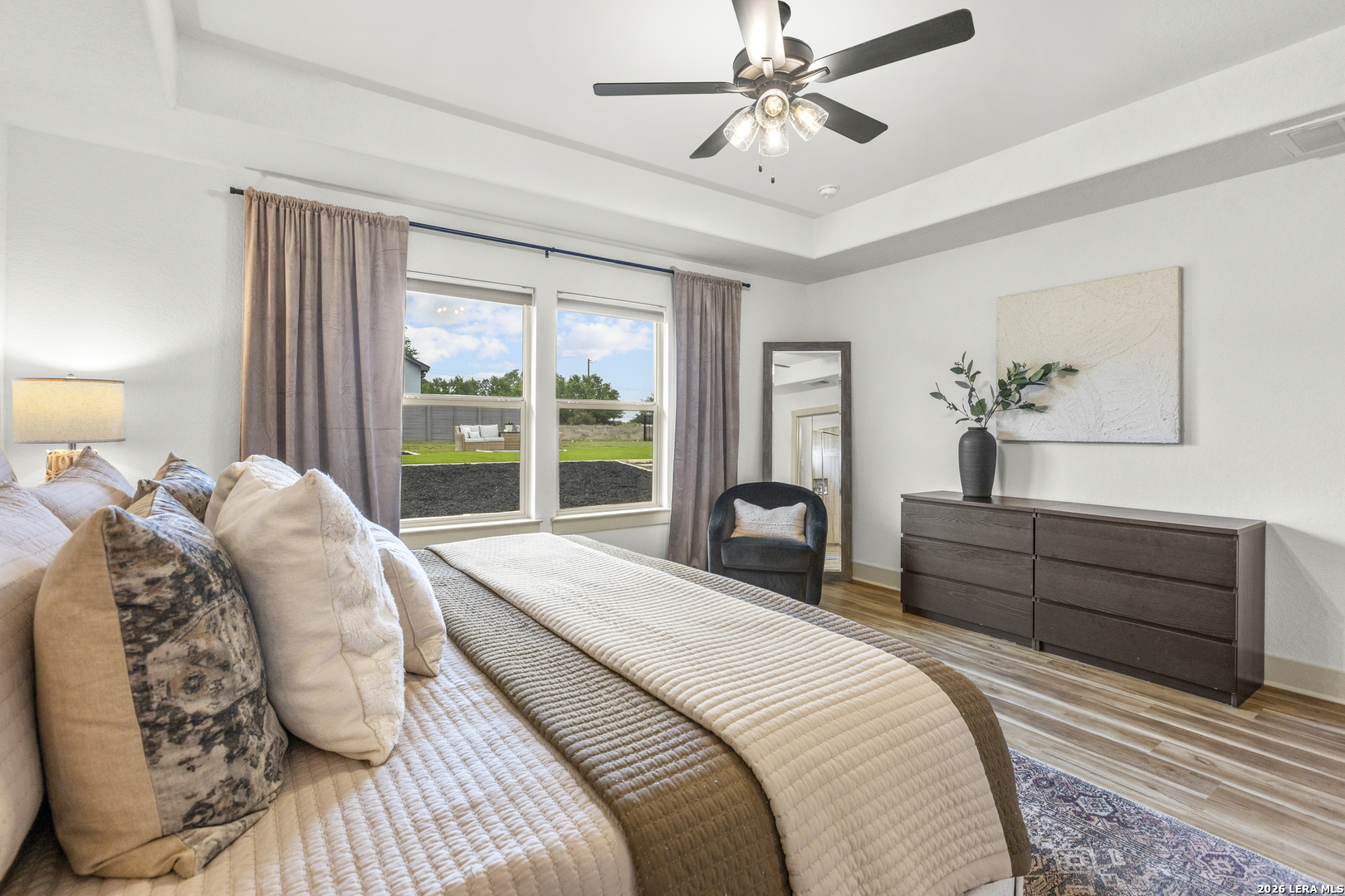 116 Hiram Cook Blanco, TX 78606 - Photo 21 of 53 a spacious bedroom with a large bed and a chandelier