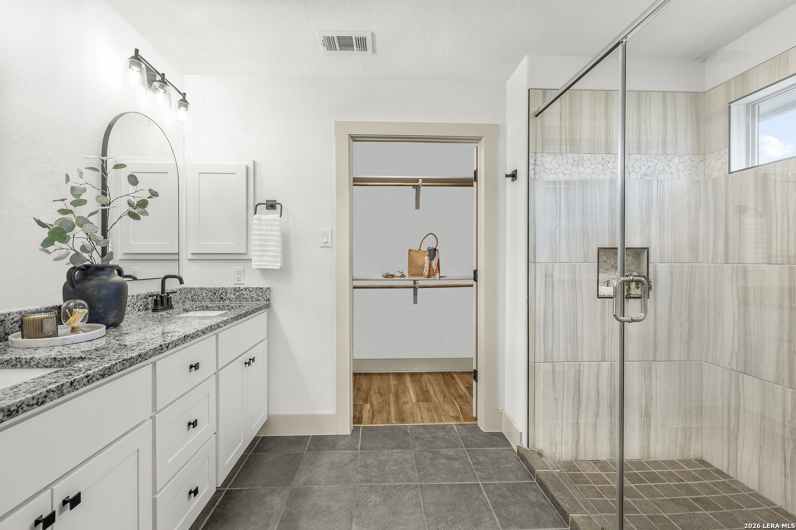 116 Hiram Cook Blanco, TX 78606 - Photo 23 of 53 a bathroom with a granite countertop sink a mirror and a shower