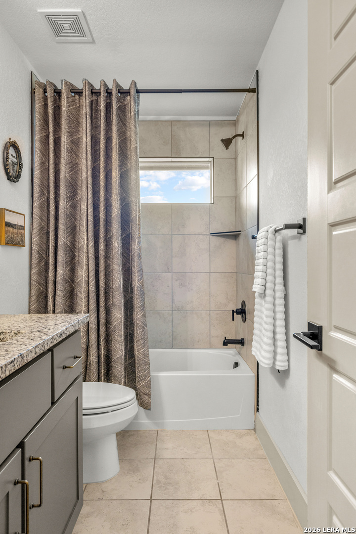 116 Hiram Cook Blanco, TX 78606 - Photo 29 of 53 a bathroom with a granite countertop bathtub shower sink vanity and toilet