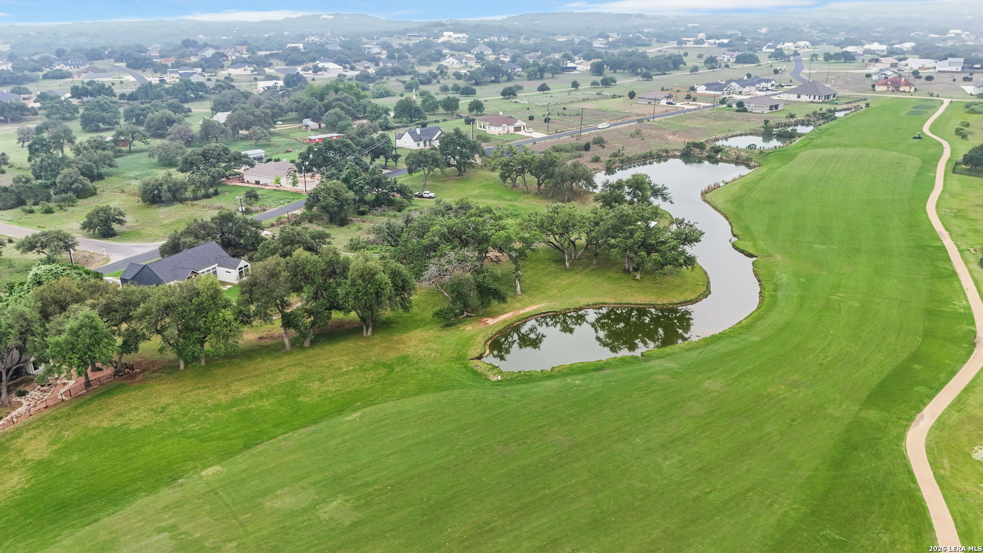 116 Hiram Cook Blanco, TX 78606 - Photo 42 of 53 an aerial view of a golf course with parking space