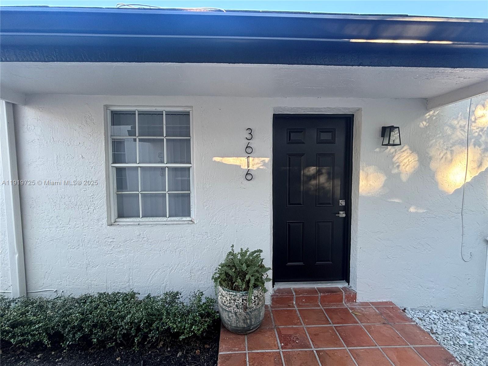 3616 Southwest 17th Street, Unit 3616 Miami, FL 33145 - Photo 1 of 16 a view of a entryway door front of house