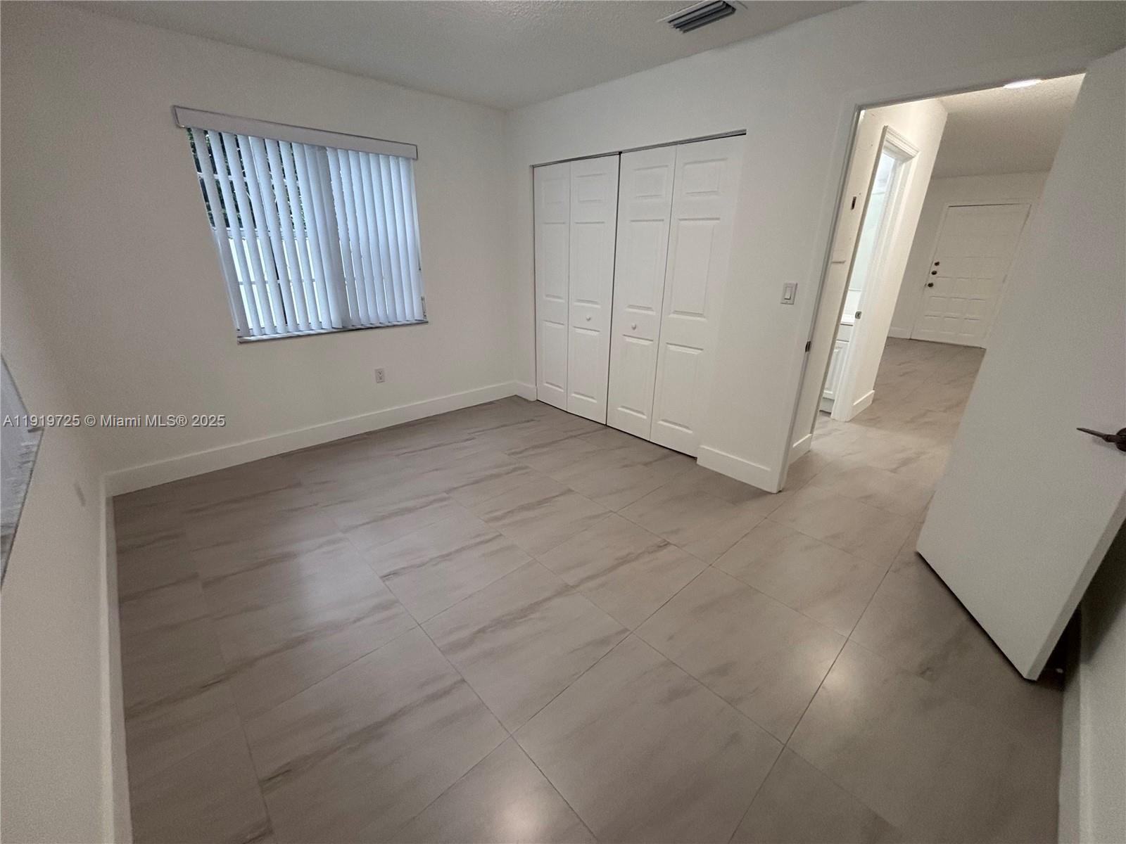 3616 Southwest 17th Street, Unit 3616 Miami, FL 33145 - Photo 3 of 16 an empty room with windows