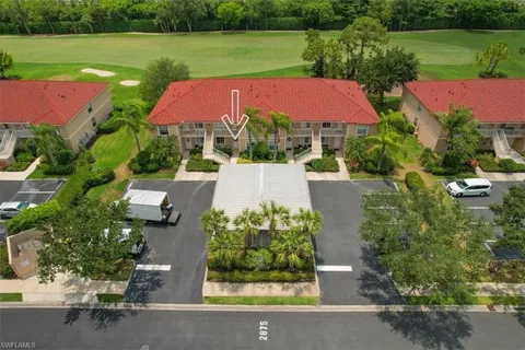 an aerial view of a house with outdoor space and street view