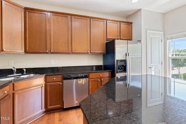a view of an empty room and wooden floor