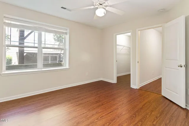 a bathroom with a sink toilet vanity and shower