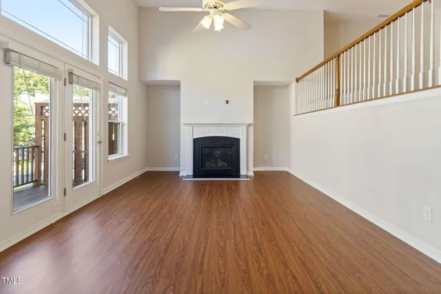 an entryway in a room with stair and a fireplace