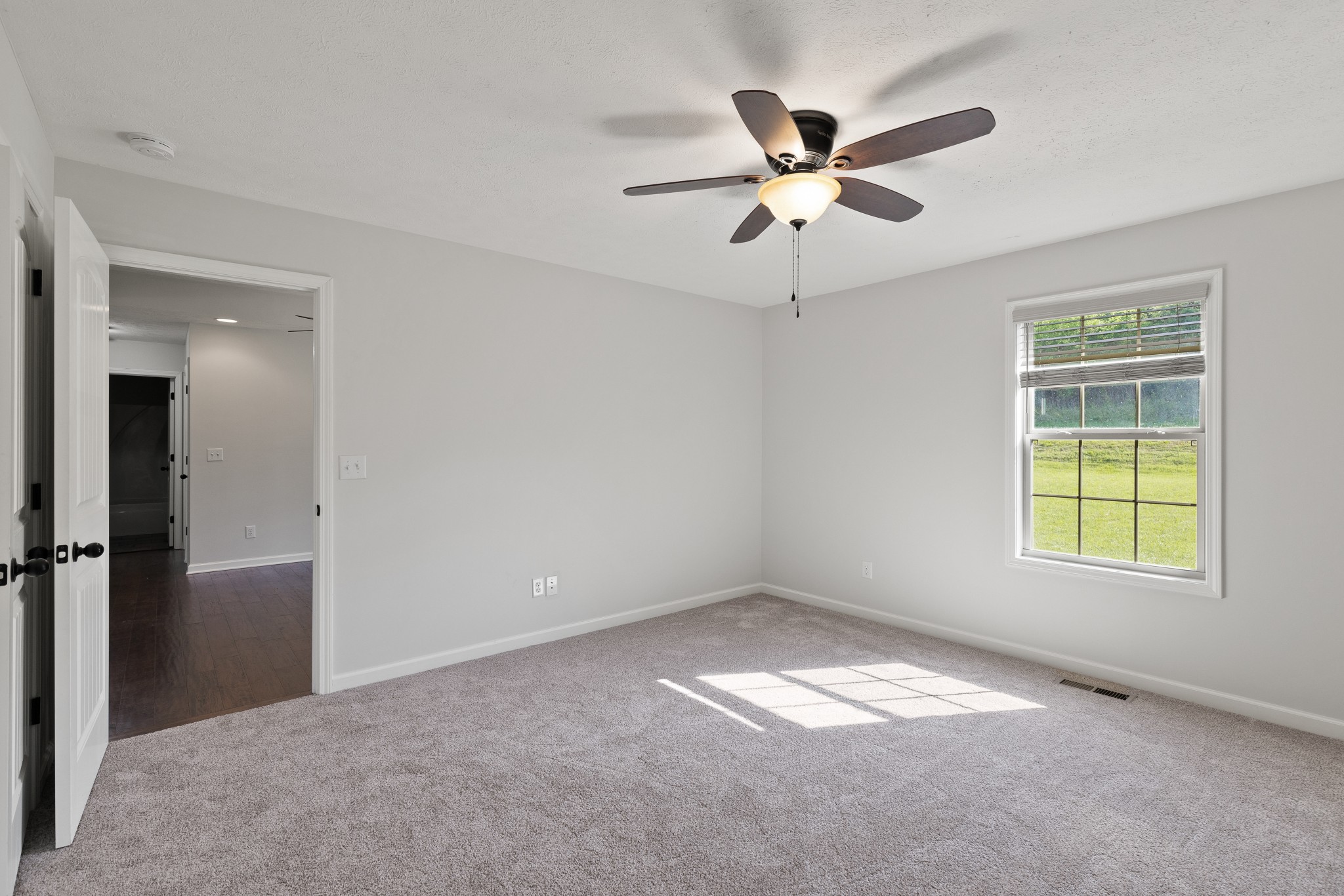 1821 Rock Bridge Road Bethpage, TN 37022 - Photo 16 of 31 an empty room with closet and windows