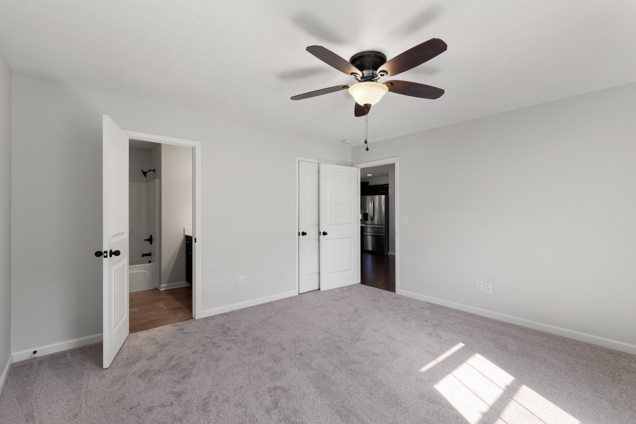 1821 Rock Bridge Road Bethpage, TN 37022 - Photo 17 of 31 a view of a big room with wooden floor and a chandelier fan