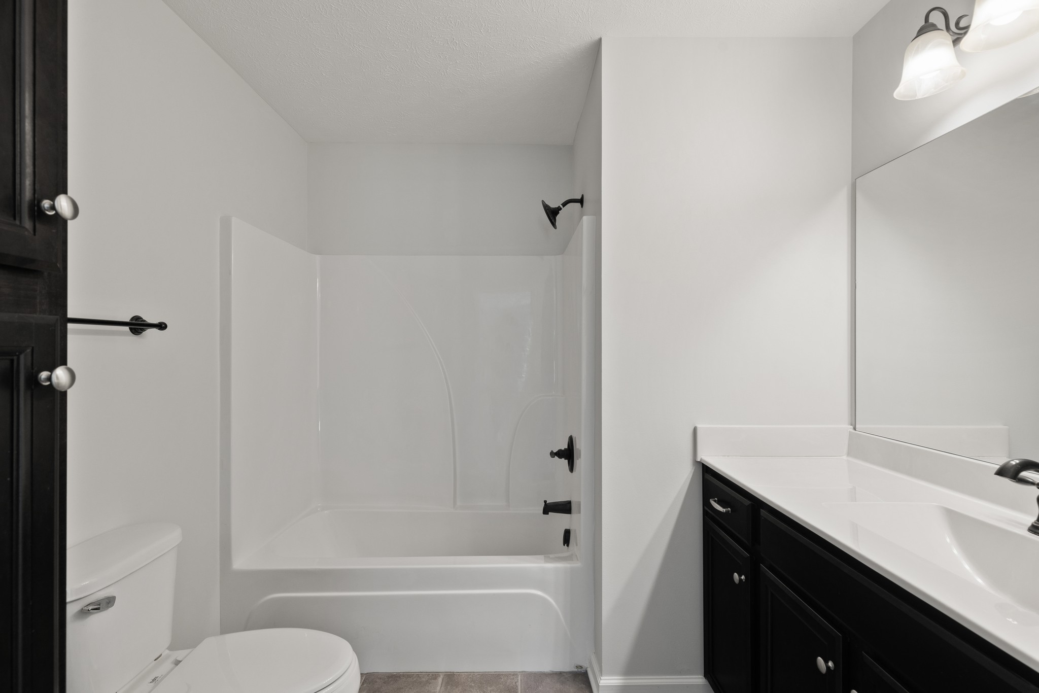 1821 Rock Bridge Road Bethpage, TN 37022 - Photo 18 of 31 a bathroom with a granite countertop sink toilet and shower