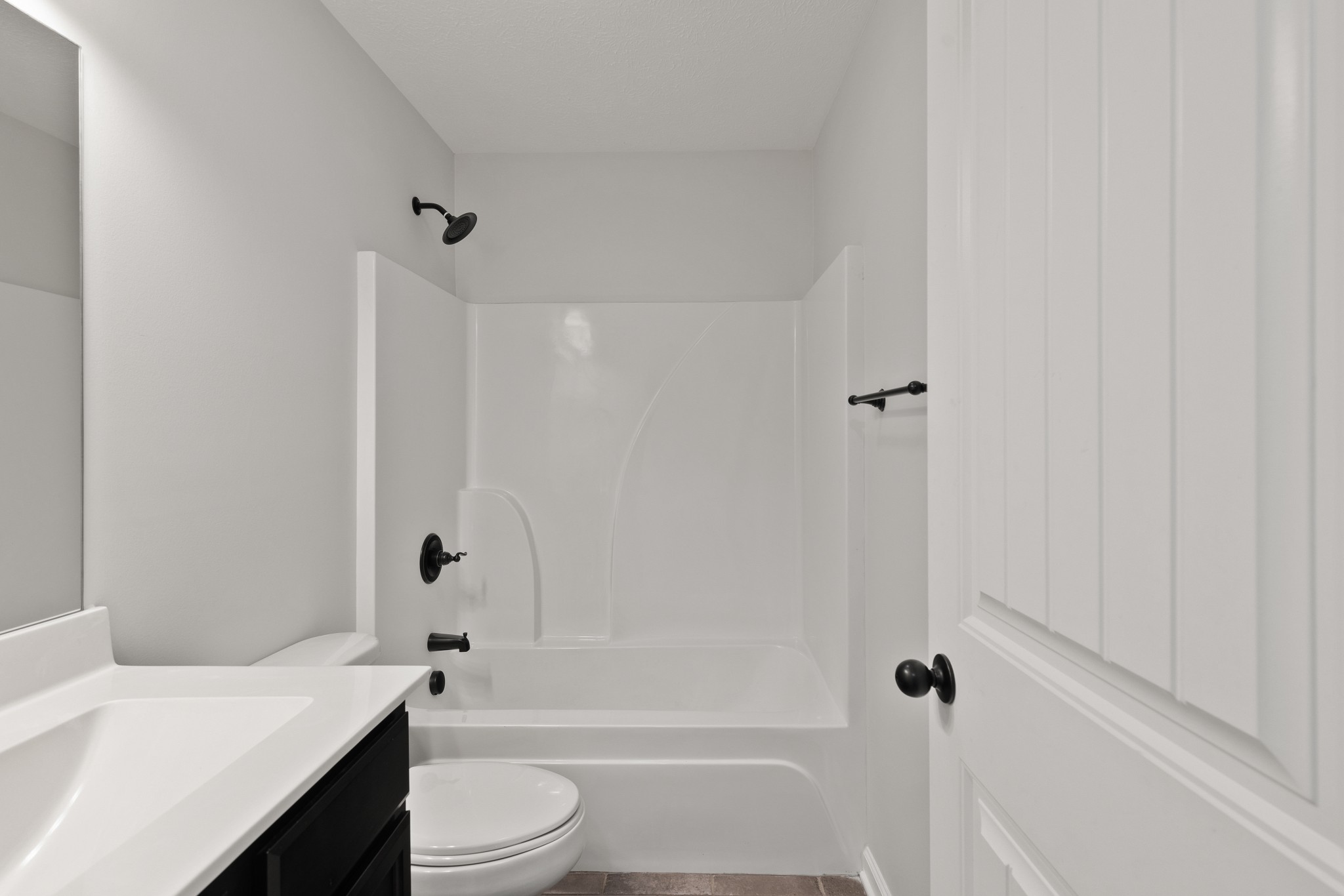 1821 Rock Bridge Road Bethpage, TN 37022 - Photo 25 of 31 a bathroom with a bathtub shower sink vanity and toilet