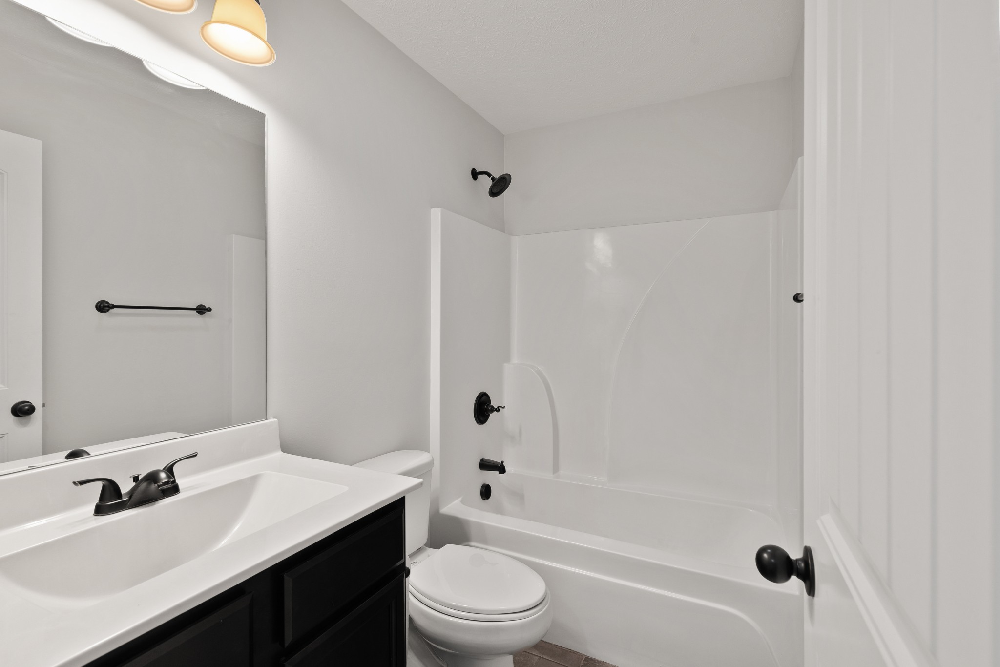 1821 Rock Bridge Road Bethpage, TN 37022 - Photo 26 of 31 a bathroom with a bathtub shower sink vanity mirror and toilet