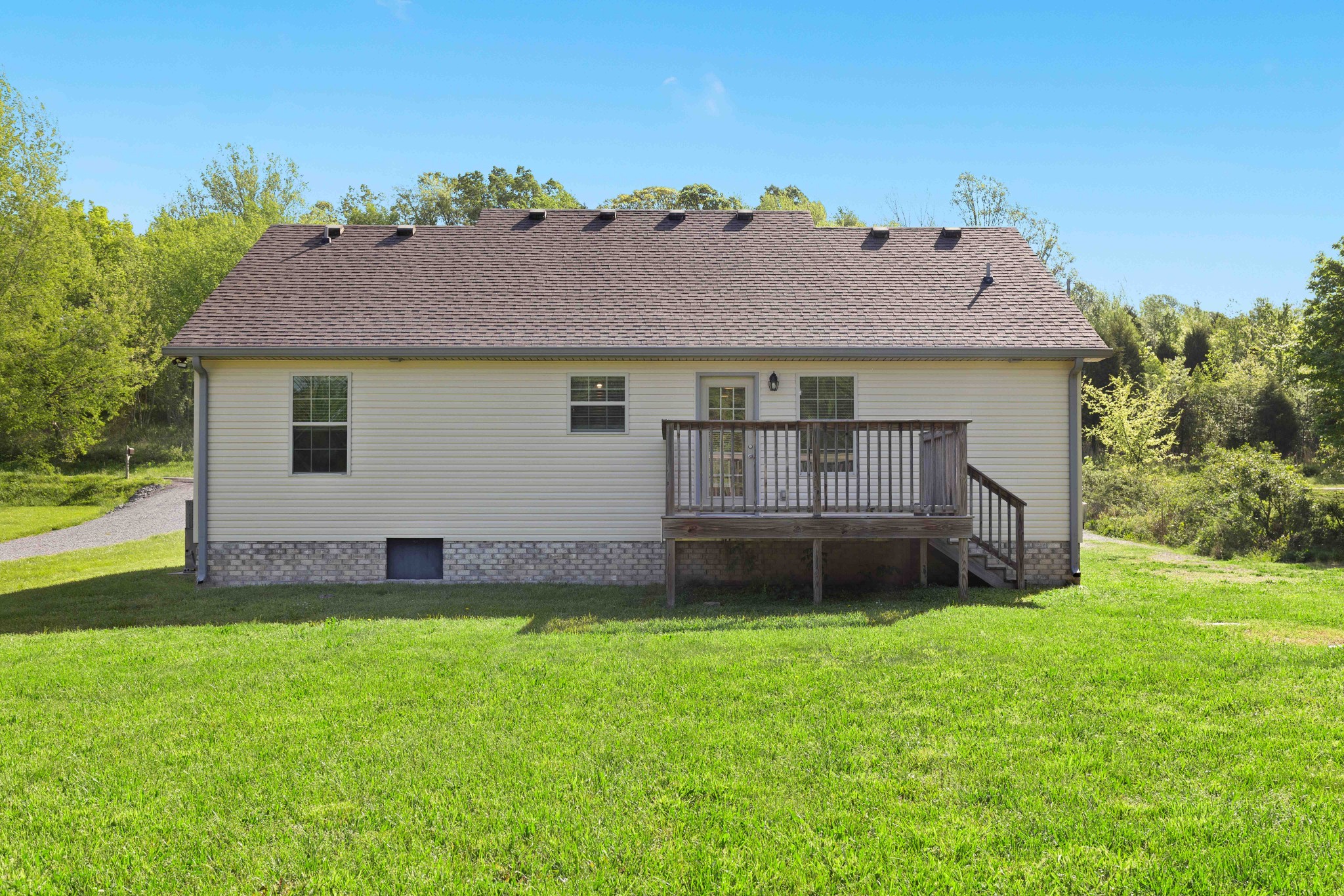 1821 Rock Bridge Road Bethpage, TN 37022 - Photo 30 of 31 a view of a house with a yard plants and large tree